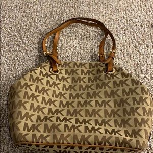 Michael Kors brown and tan over the shoulder bag.